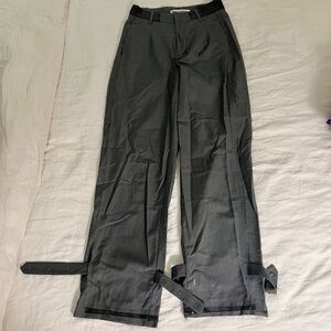 Gray trousers with raw hem and back buckle detail
